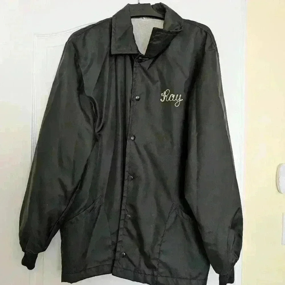 Vintage men's black bowling jacket with the name Ray embroidered on the front